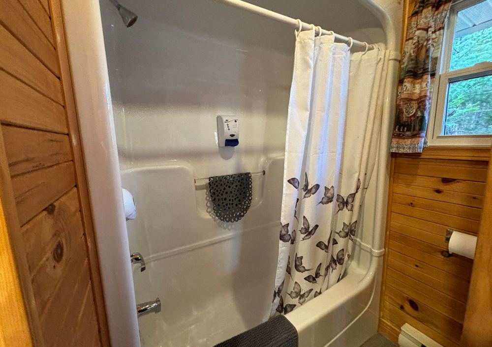 An image of the bathroom in one of the wooden cabins at Tidal Bore Rafting Resort.