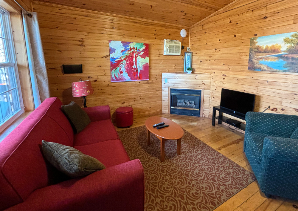 An image of one of the main living room areas in a one bedroom cottage at Tidal Bore Rafting Resort.