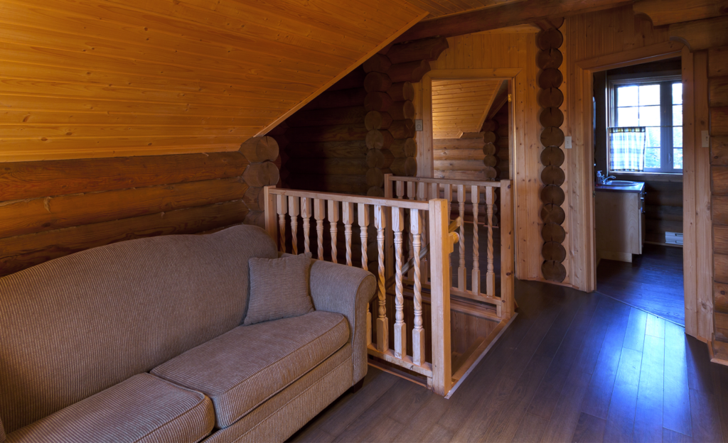 An image of the upstairs loft in one of the two storey log cabins at Tidal Bore Rafting Resort.